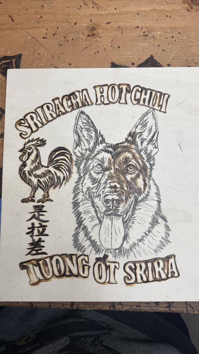 The dog piece with all lettering burned and shading started on the German Shepherd's face